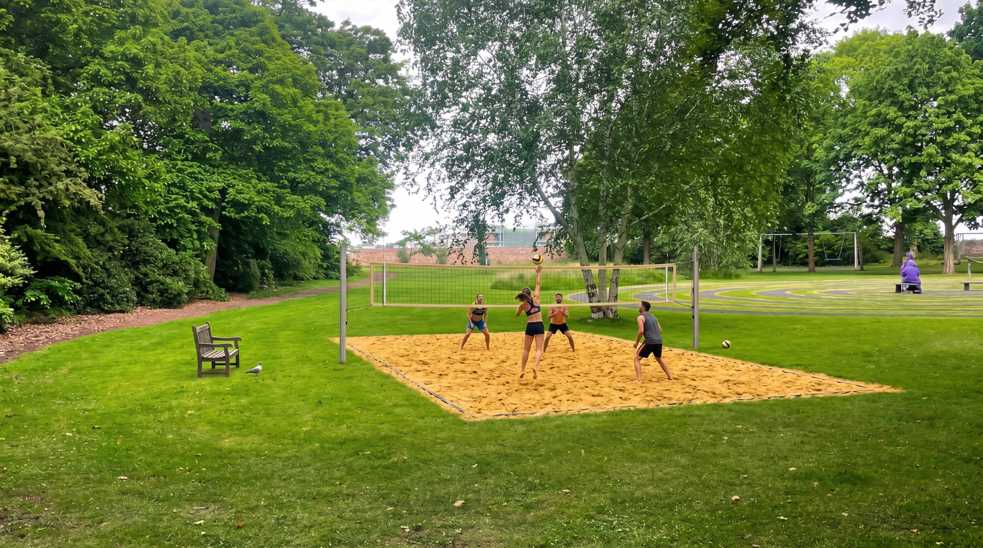 People playing beach volleyball in Kinburn Park