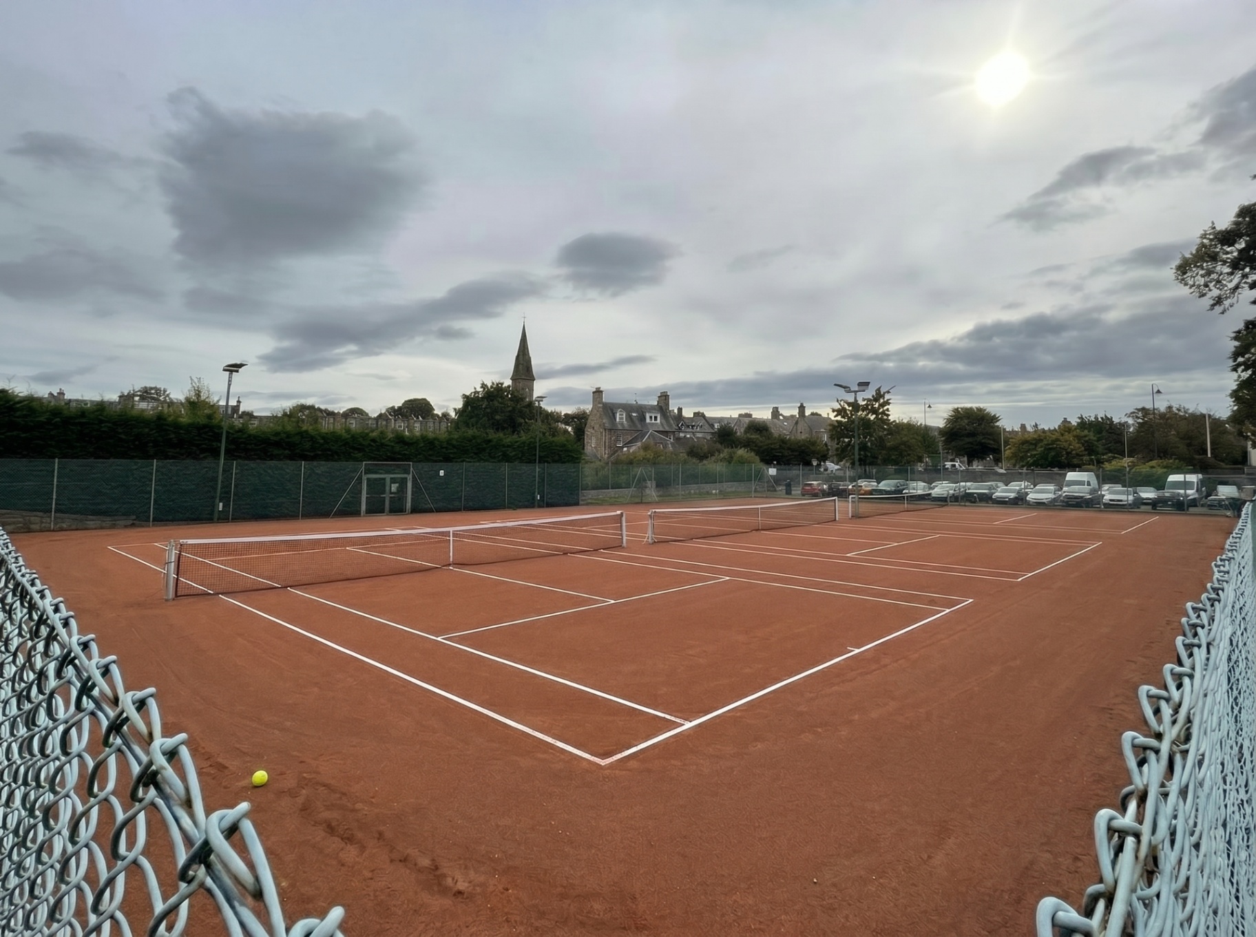 A line of three clay courts in a concept view